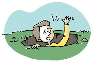 Une personne dont seulement la tête et le bras gauche sortent du trou. La tête suggère de la détresse ou de l’inconfort. Il y a des rochers et de l’herbe autour de l’individu.
